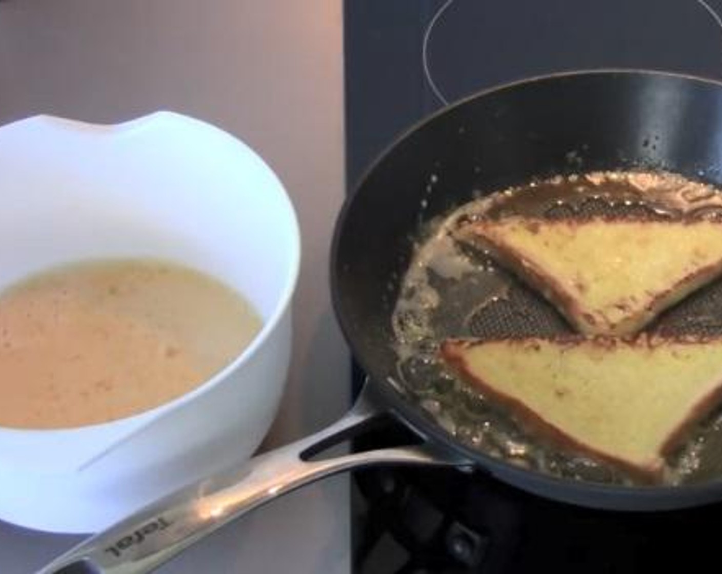 step 4 In a frying pan over medium heat, melt the Butter (1 oz). Take each slice of bread, put it in the egg mixture, and fry it one minute on each side.