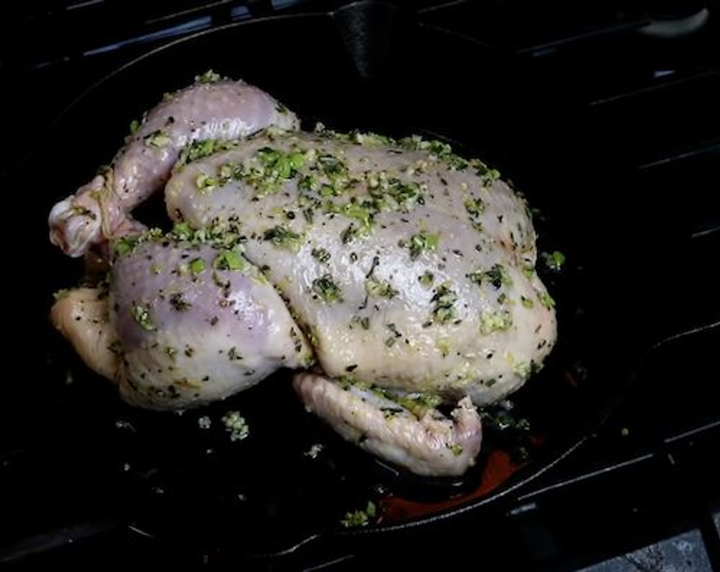step 4 Using some kitchen string tie the chicken legs together, then place the chicken in the center of the preheated oven.