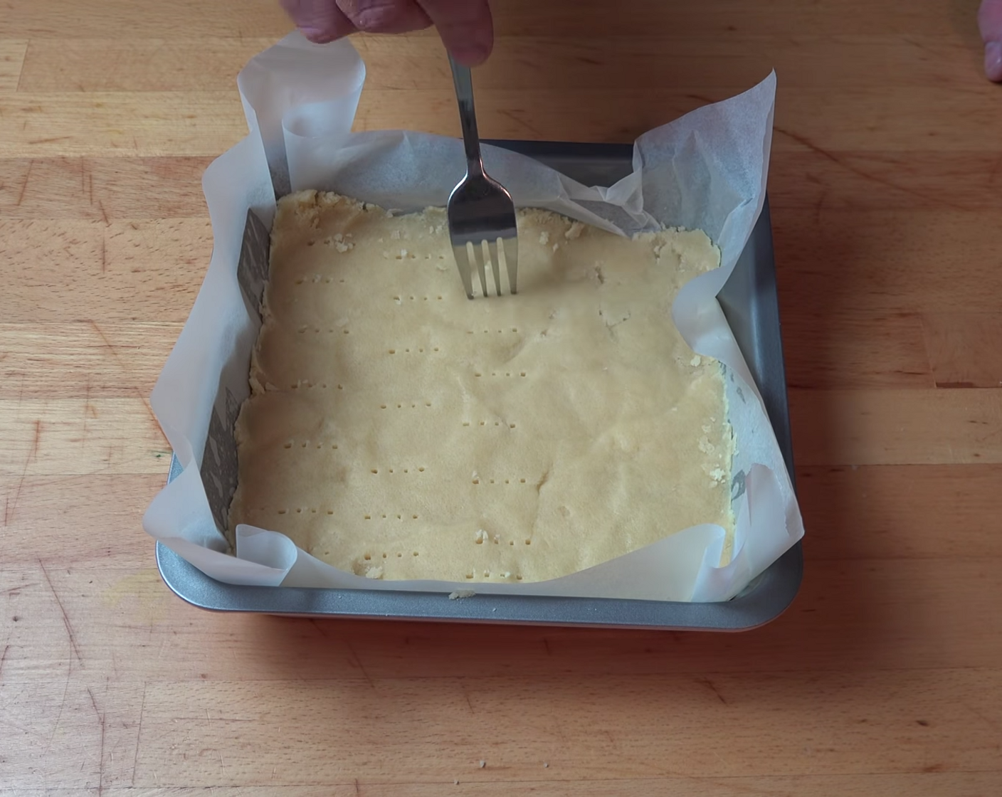 step 7 Using folk points, make little indent marks across the surface of the dough. This stops the dough from rising when it bakes.