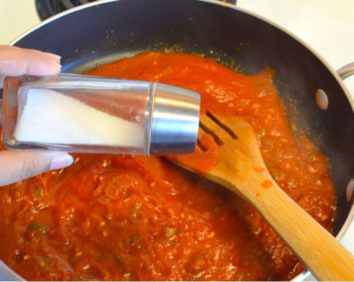 step 9 Pour in Tomato Sauce (1 cup) and season with salt and let it bubble for a few minutes.
