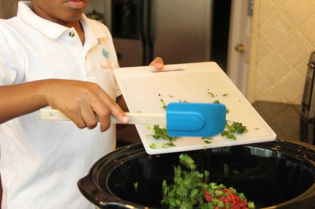 Step 3 of Slow Cooker Southwest Chicken Recipe: Add Low-Sodium Chicken Broth (1 2/3 cup), Frozen Corn (1 cup), Canned Black Beans (15 ounce), cilantro, green onions, tomatoes, Ground Cumin (1 teaspoon) and seasoned chicken to a slow cooker. Cook on high for 6 hours.