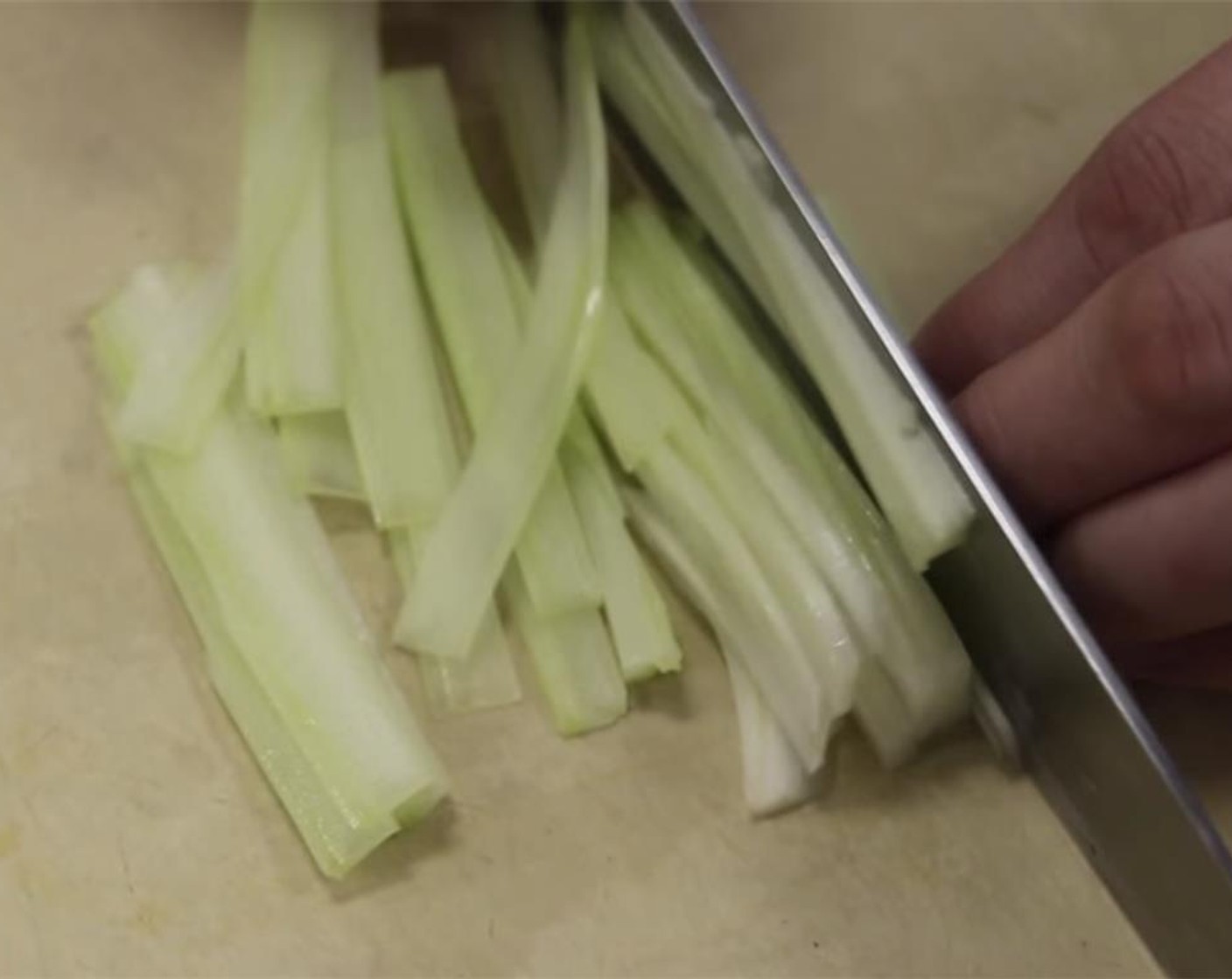 step 7 Cut a stick of Celery (1/3 cup) in half, then cut it again and slice into thin strips.