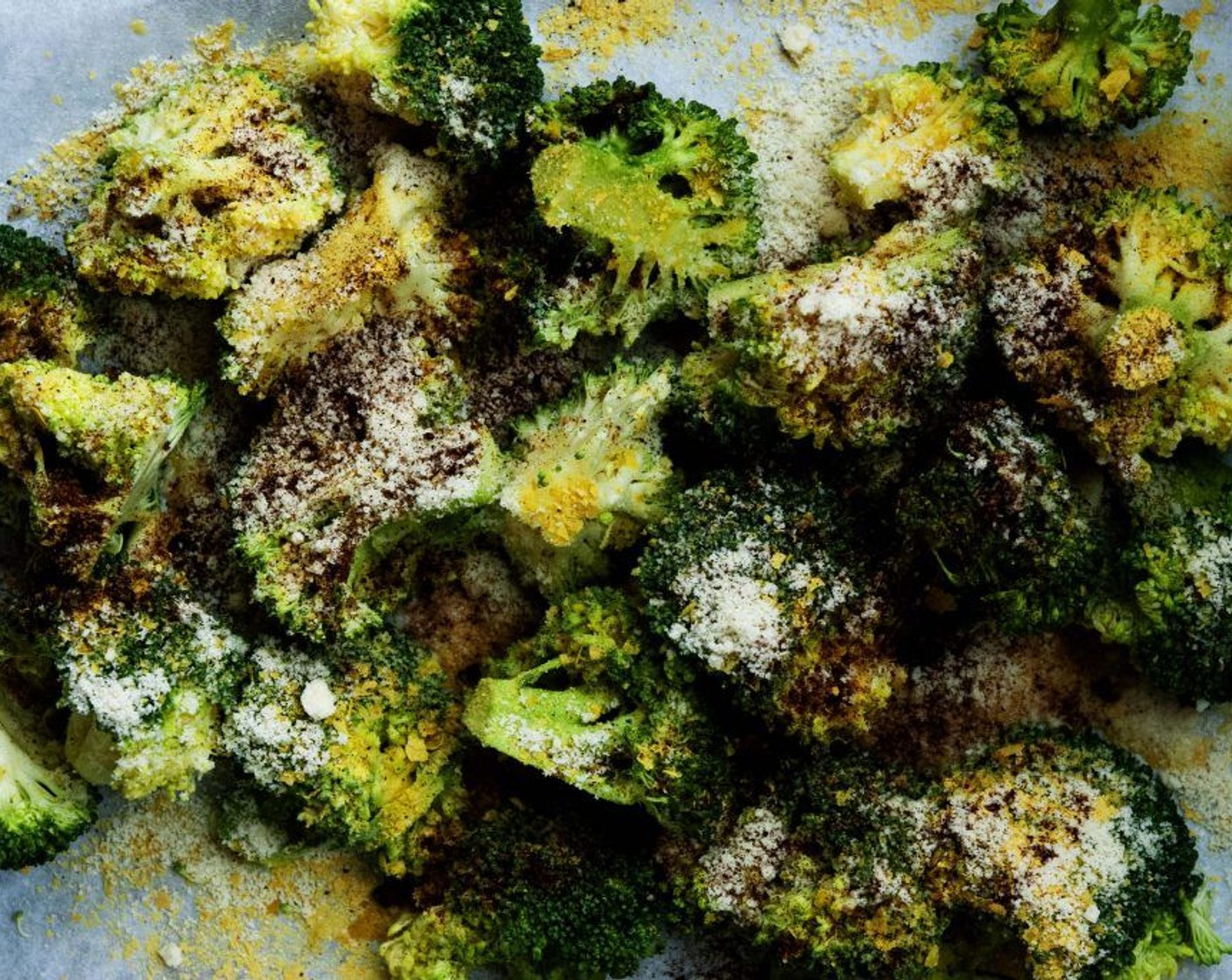 step 2 Chop your Broccoli (6 cups) into florets and spread them on a baking sheet. Drizzle with Extra-Virgin Olive Oil (1/4 cup), Nutritional Yeast (3 Tbsp), Almond Flour (3 Tbsp), Salt (1 tsp) and Paprika (1/2 tsp).