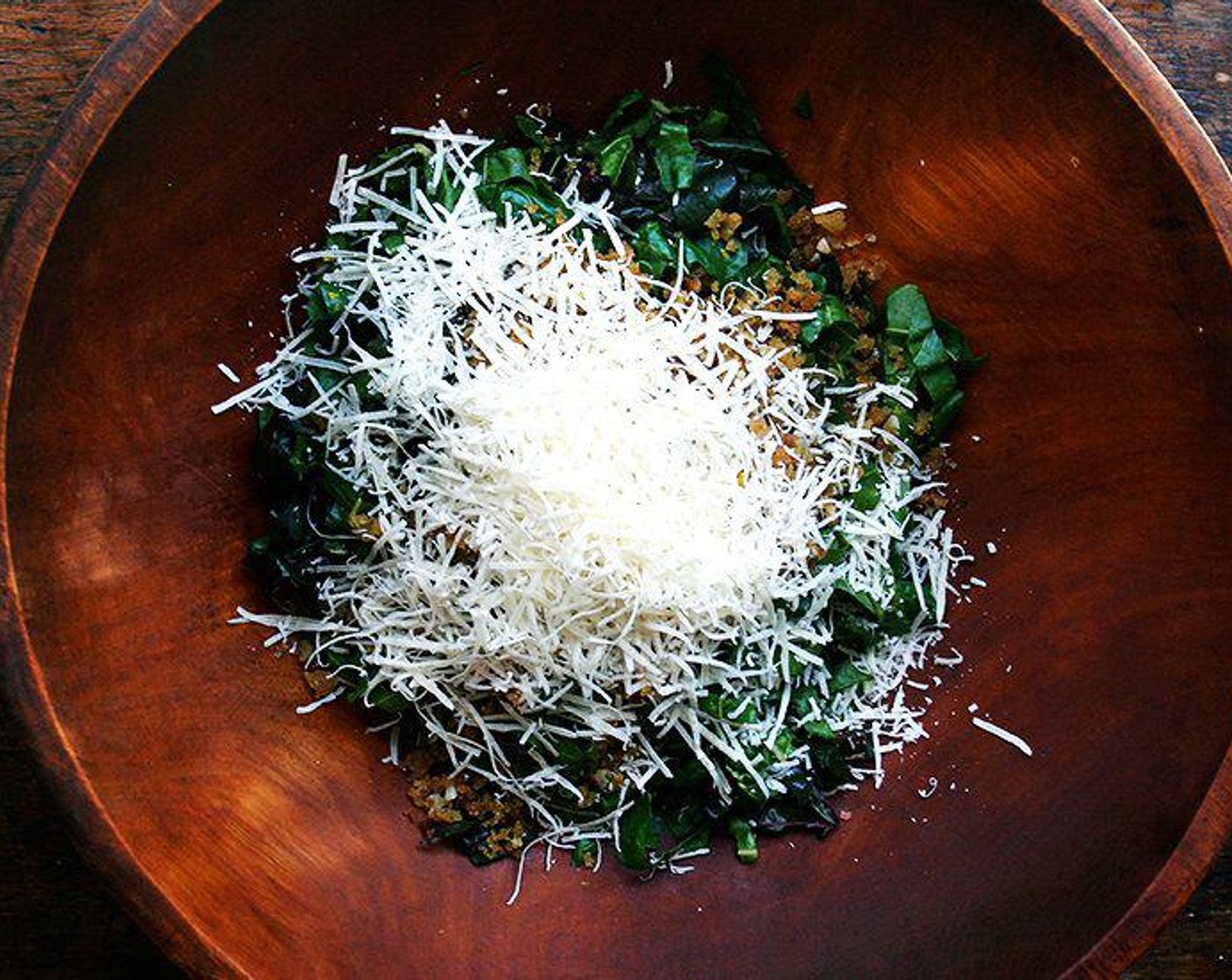 step 5 Add the Parmesan Cheese (3/4 cup) and about ⅔ of the lemon dressing to the bowl. Toss until nicely coated. Taste and add more dressing if you like. Toss in the toasted breadcrumbs.