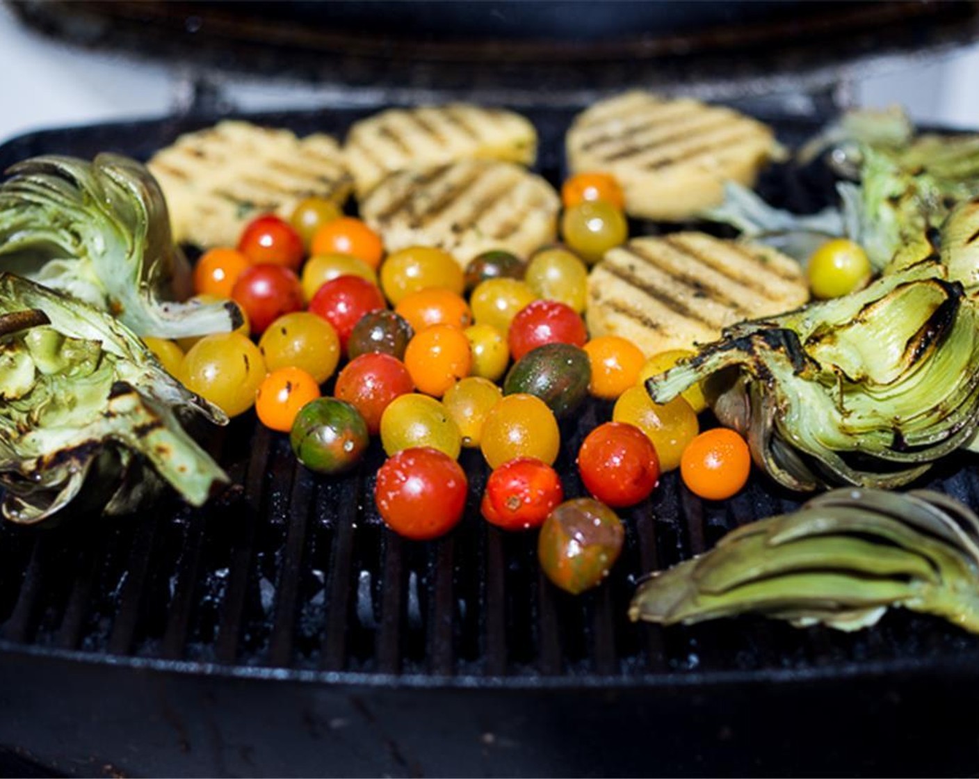 step 15 Char the cherry tomatoes until thy blister slightly. Arrange them around polenta and artichokes.