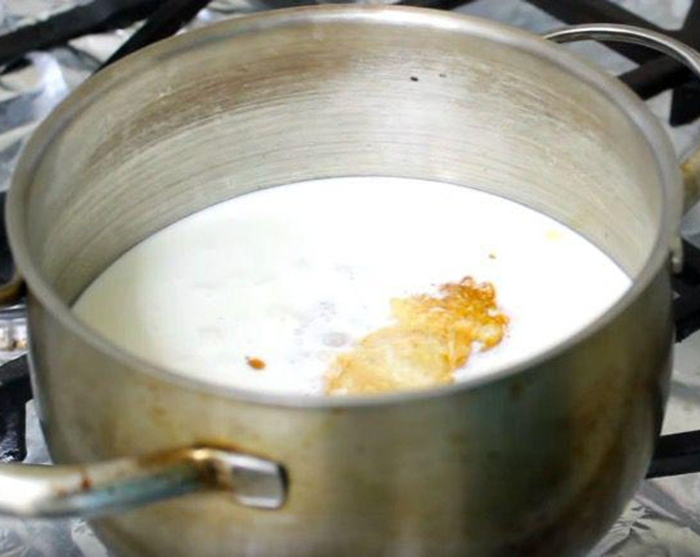step 1 In a heavy-bottomed saucepan over medium heat, add Heavy Cream (3 cups) and Vanilla Extract (2 tsp). When mixture starts to form bubbles, remove it from the heat.
