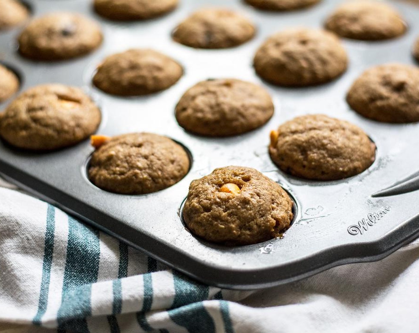 step 5 Add batter to muffin pan, evenly distributed, then bake for 10-11 minutes or until olden brown on top and a toothpick comes out clean.