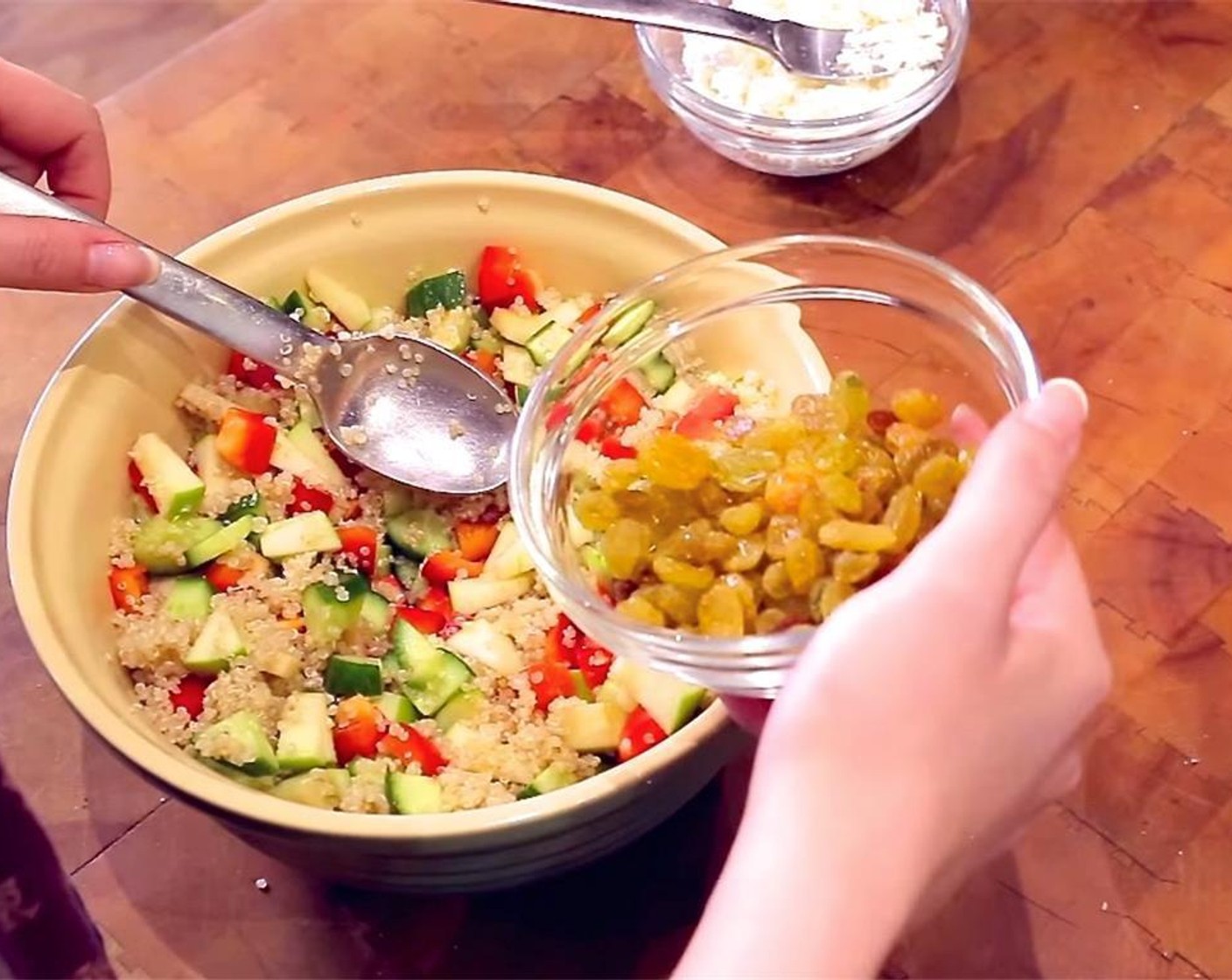 step 3 In a bowl, combine the cucumber, bell pepper, apple, quinoa, and Golden Raisins (4 Tbsp). Mix together. Add the dressing, and toss to combine.