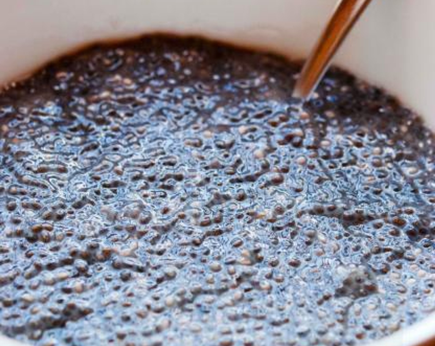 step 1 The night before, pour Rice Milk (1 cup) and Chia Seeds (4 Tbsp) into a large bowl. Cover with plastic wrap and let it sit in your fridge overnight.