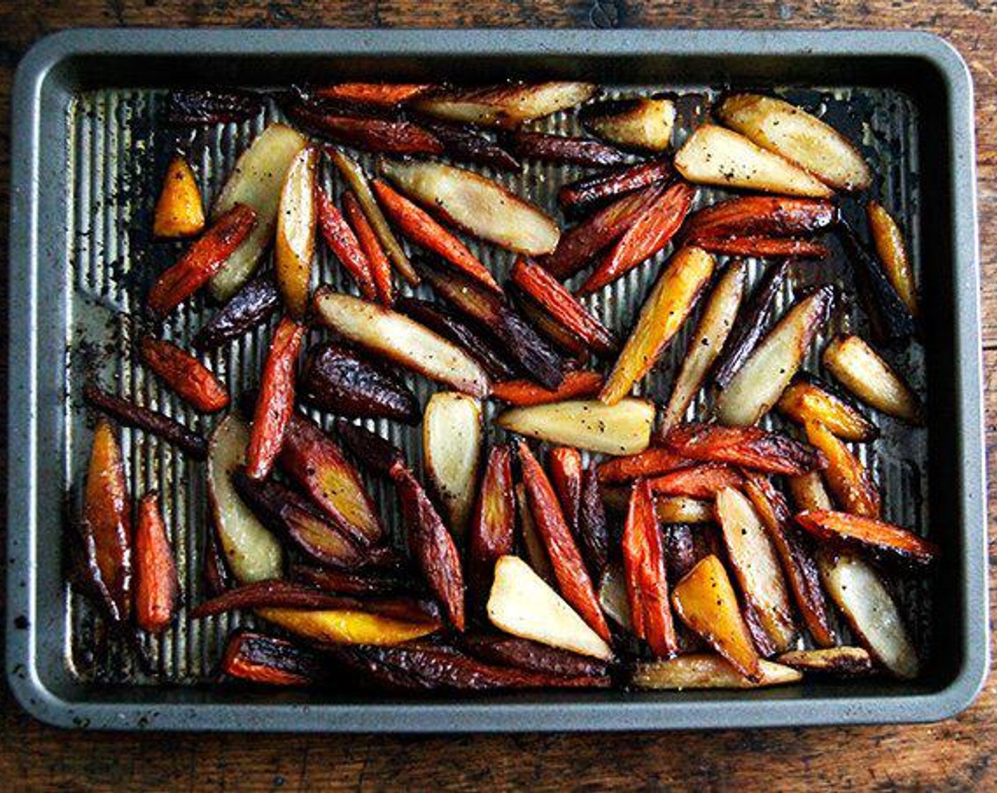 step 5 Scrape everything into a serving bowl, taste, and adjust with more vinegar, salt, or pepper. Top with the Roasted Almonds (1/2 cup).