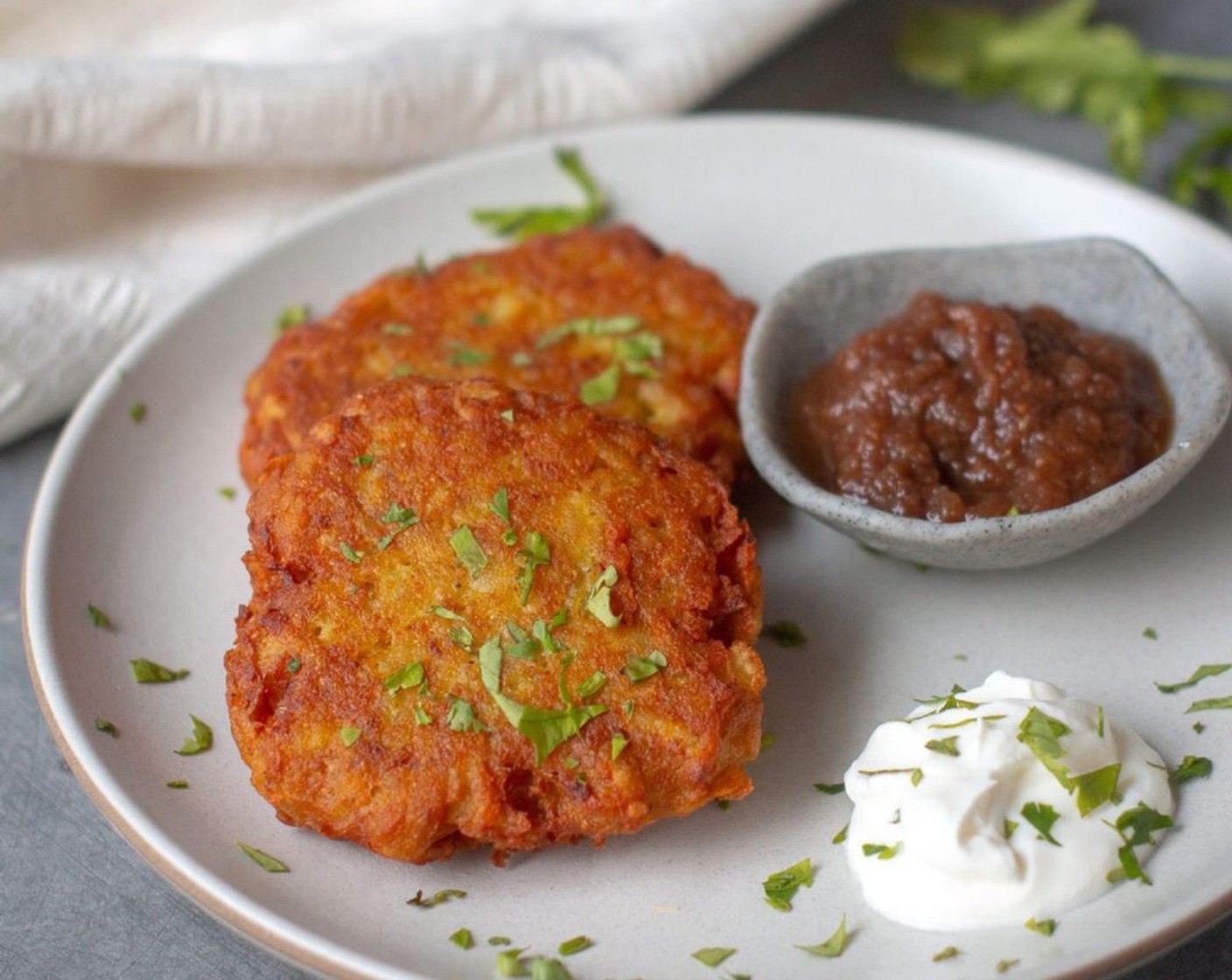 step 11 Garnish your latkes with cilantro and serve with sour cream and apple butter chutney!