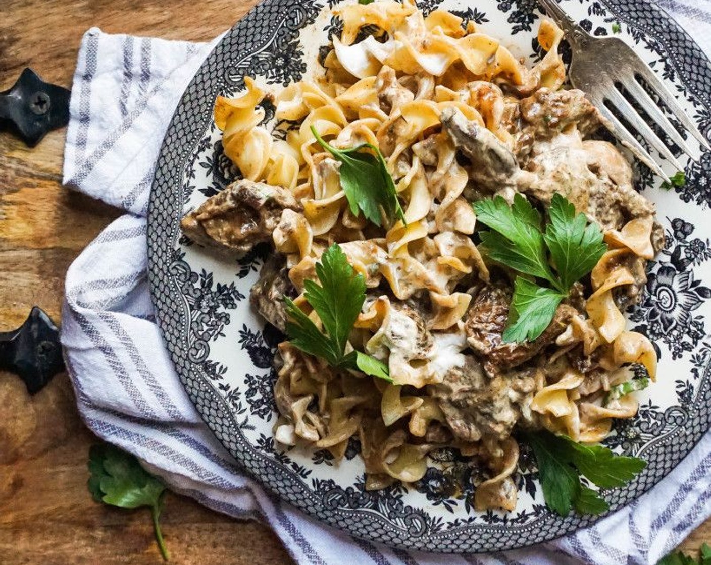 step 9 To plate, add the noodles, beef, and a spoonful of Sour Cream (1/2 cup). Mix it all up, then garnish with Fresh Parsley (to taste). Enjoy!