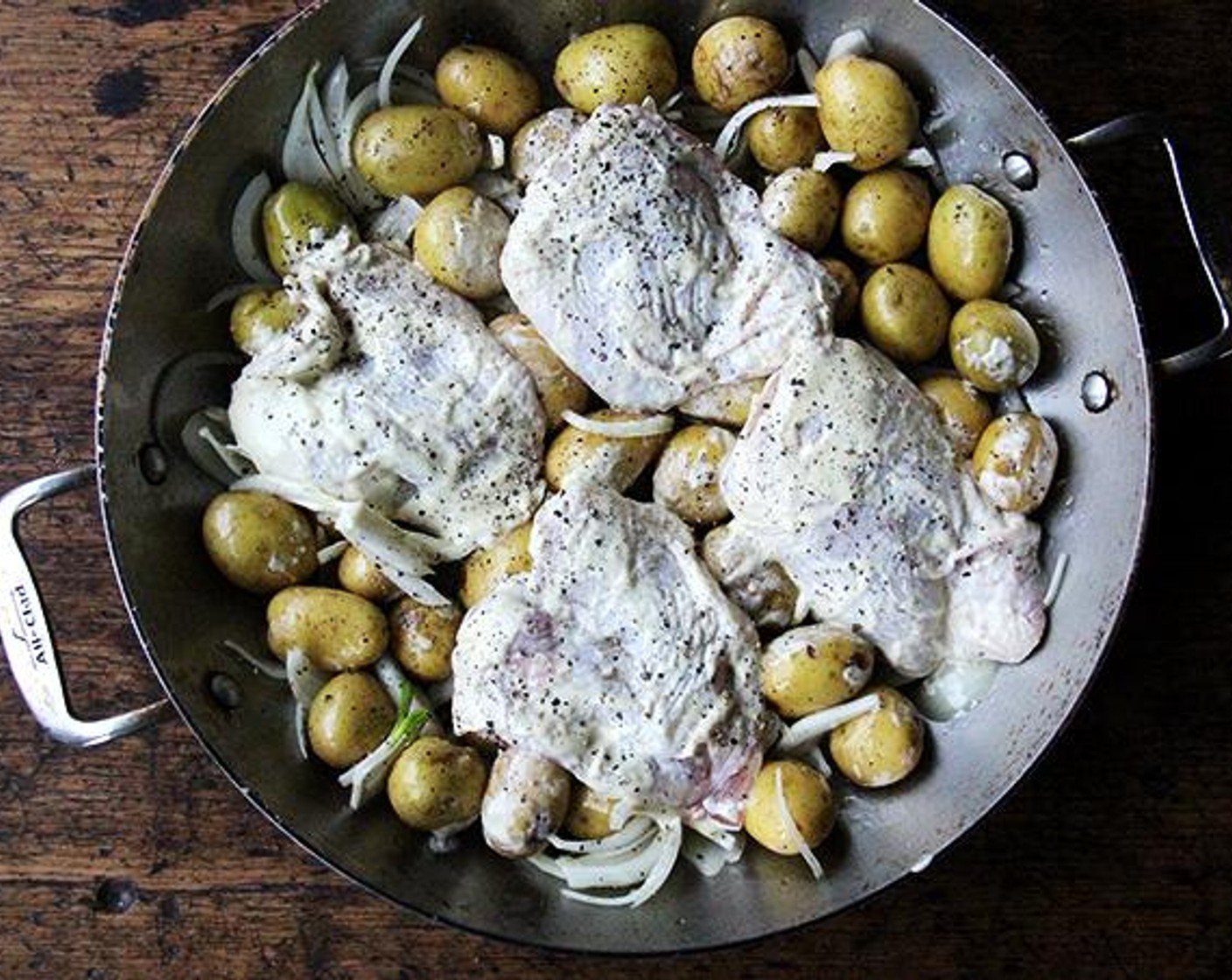 step 4 Season all over with Kosher Salt (to taste) and Ground Black Pepper (to taste). Nestle the thighs on top of/in between the potatoes. Crack more pepper over top if you wish.