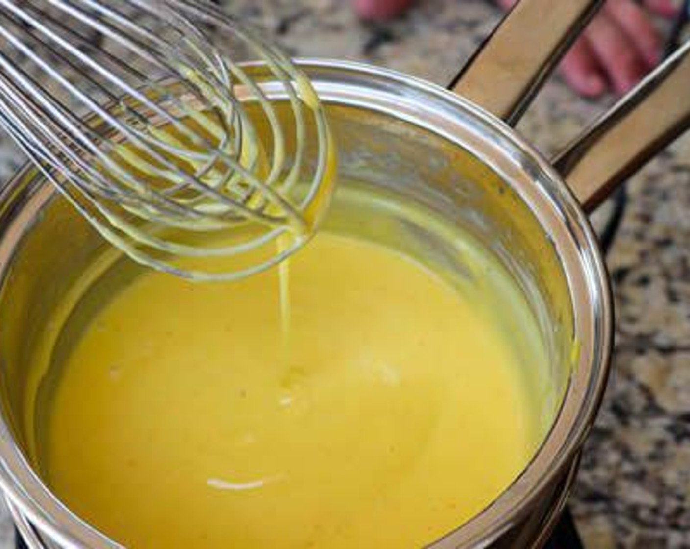 step 4 Place over double boiler and slowly whisk in Unsalted Butter (1/2 cup) a little at a time careful not to cook the eggs. Mixture will begin to thicken after a few minutes of whisking. Add Cayenne Pepper (1/4 tsp) and Salt (1 pinch) and keep warm until ready to serve.