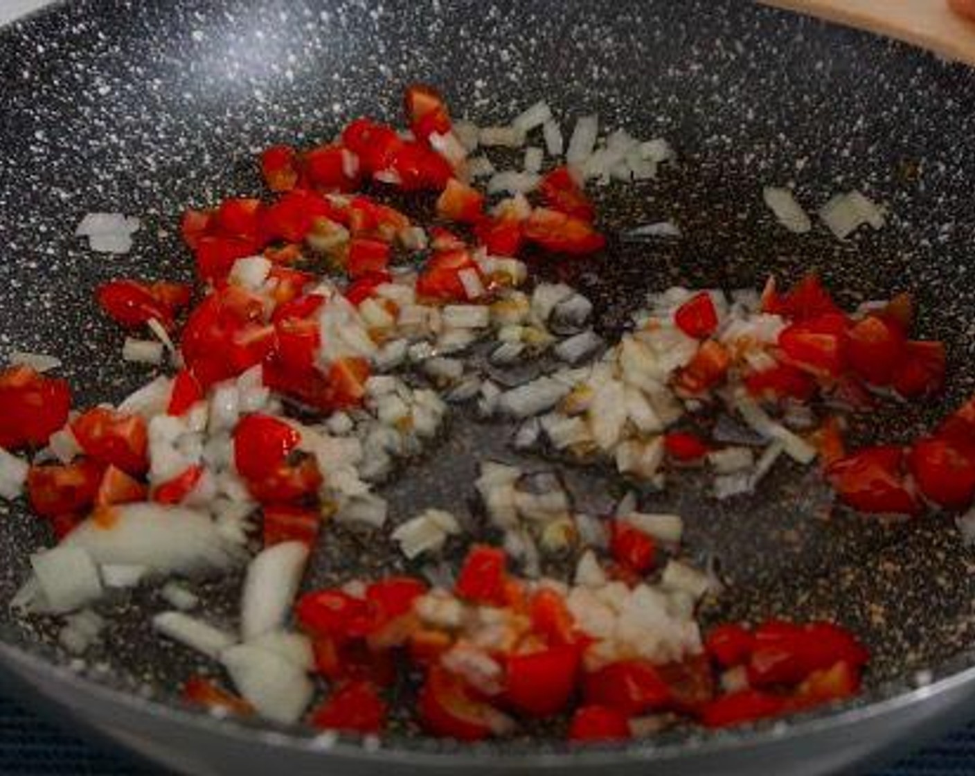 step 2 Then add the Onion (1/2 cup) and Plum Tomato (1/2 cup) and leave to cook for 5 minutes until the veggies are soft.