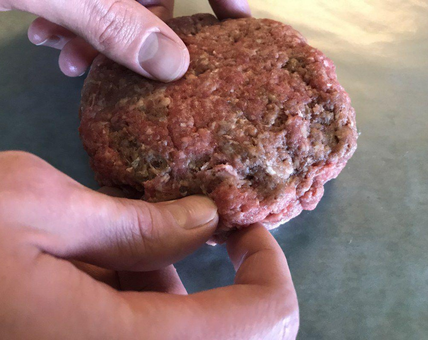 step 5 Seal edges together by firmly pressing the ground meat with fingers, ensuring the cheese doesn't leak.