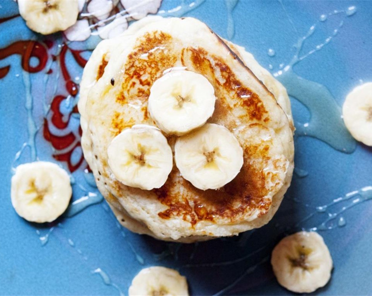 step 7 Slice up the remaining bananas and use it to decorate your pancakes. Drizzle some Maple Syrup (to taste) and serve. Enjoy!