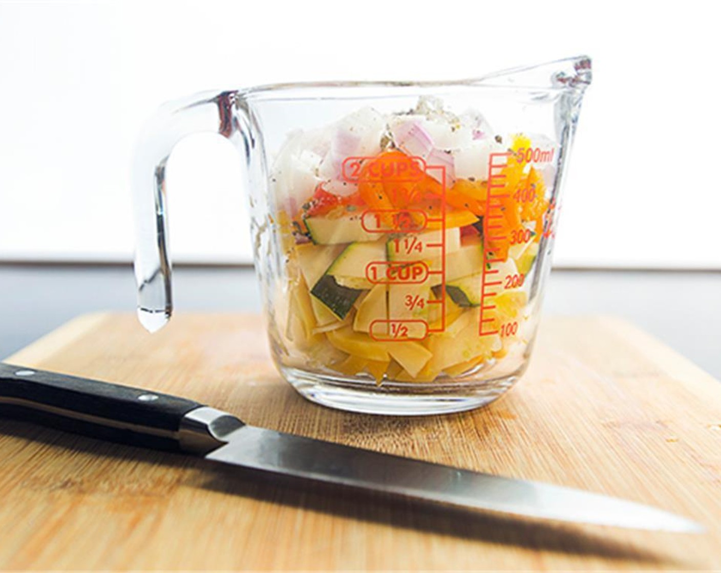 step 1 Prepare the Squash (1 cup), Onion (1/3 cup), Bell Pepper (1/2 cup), Fresh Oregano (1 Tbsp), and mince the Garlic (2 cloves).