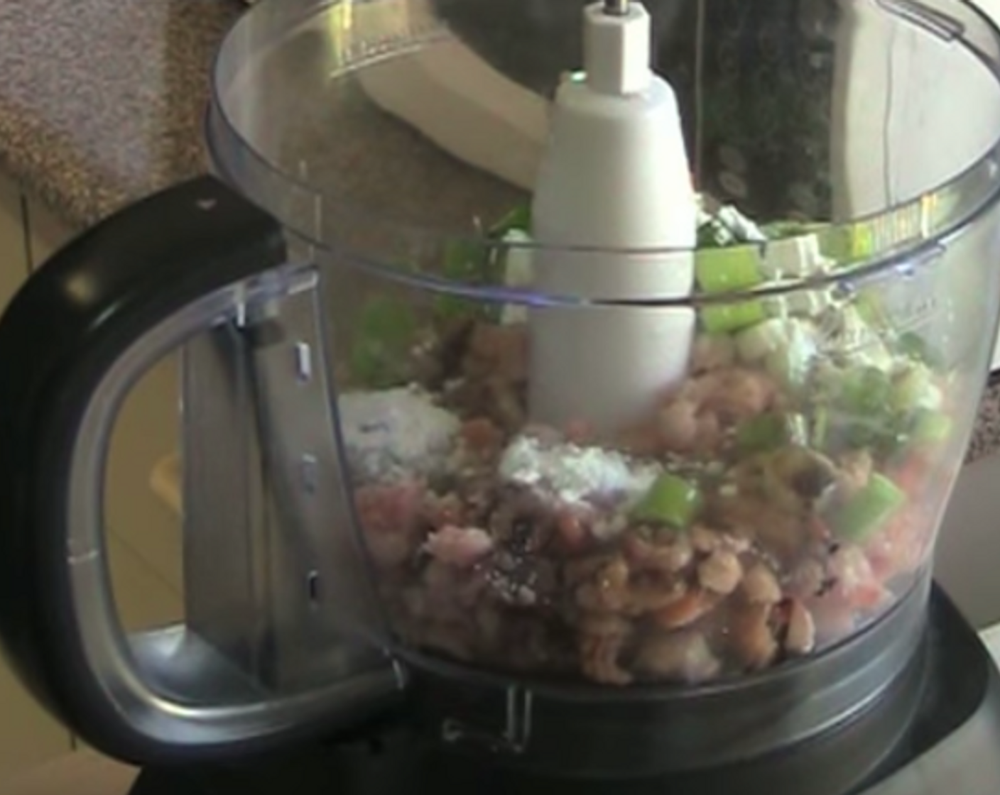 step 2 Put in Shrimp (14 oz), chopped Scallion (1 bunch), Egg White, Ground White Pepper (1/2 tsp), Corn Flour (1 tsp), Fresh Ginger (2 tsp), and Soy Sauce (2 tsp) in the blender. Whisk them up until smooth.