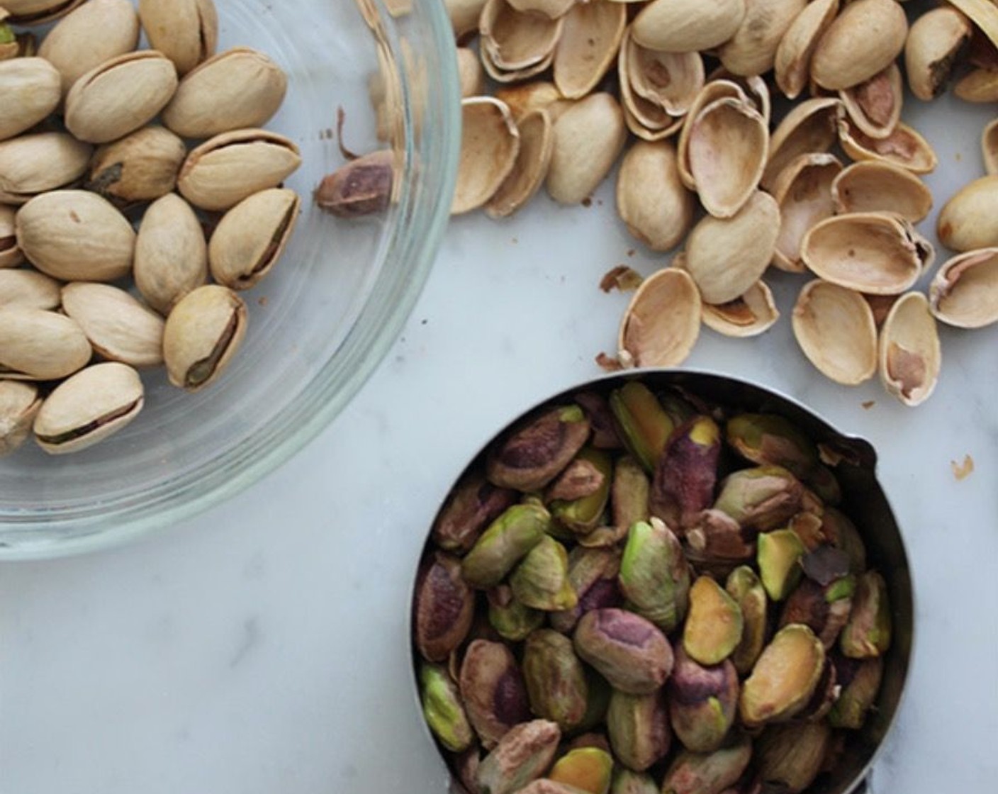 step 5 Place the Shelled Unsalted Pistachios (1/3 cup) in the bowl of a food processor and process until coarsely chopped. Remove 1 1/2 tablespoons and set aside for garnish. Continue processing until the pistachios are very finely ground. Measure to make sure you have 1/4 cup, and add it to the bowl with the dry ingredients.