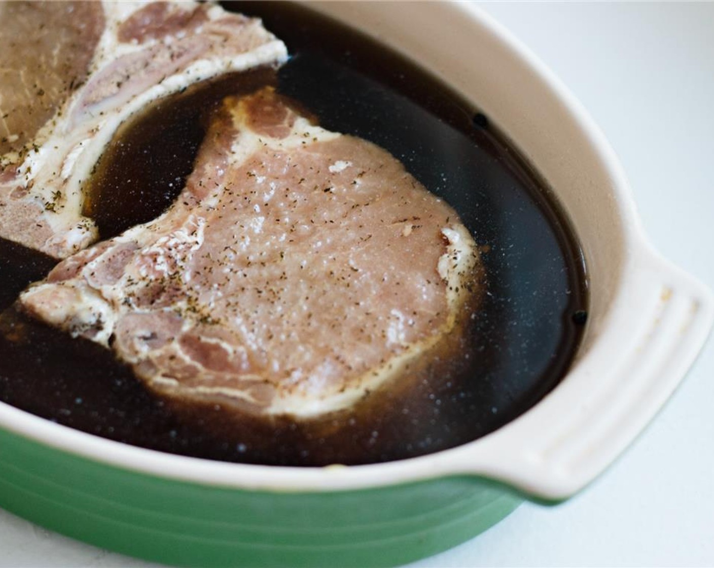 step 3 Arrange the Bone-In Pork Loin Chops (4) in a baking dish, plastic storage container, or 1-gallon plastic bag so that they fit snugly; pour the maple brine over them to cover completely. Cover and refrigerate for at least 24 hours and ideally up to 48 hours.