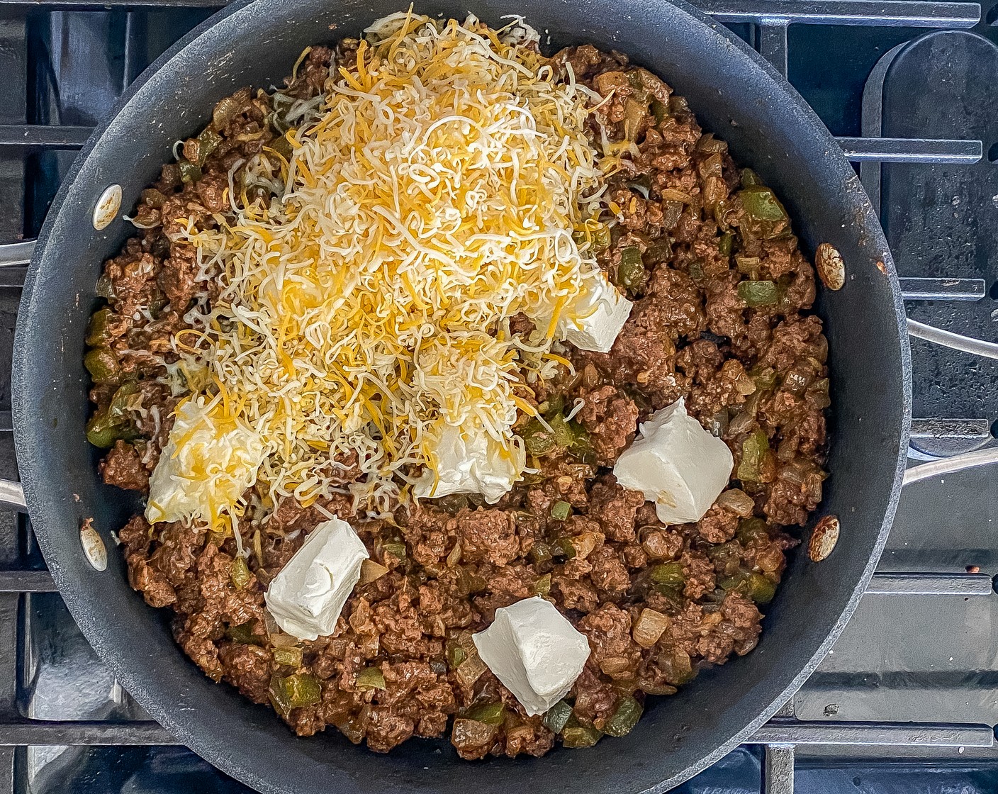 step 3 Reduce heat to medium-low, add in Cream Cheese (1/2 cup) and Shredded Mexican Cheese Blend (1 cup) and constantly stir until cheese is melted and thoroughly combined. Remove from heat.