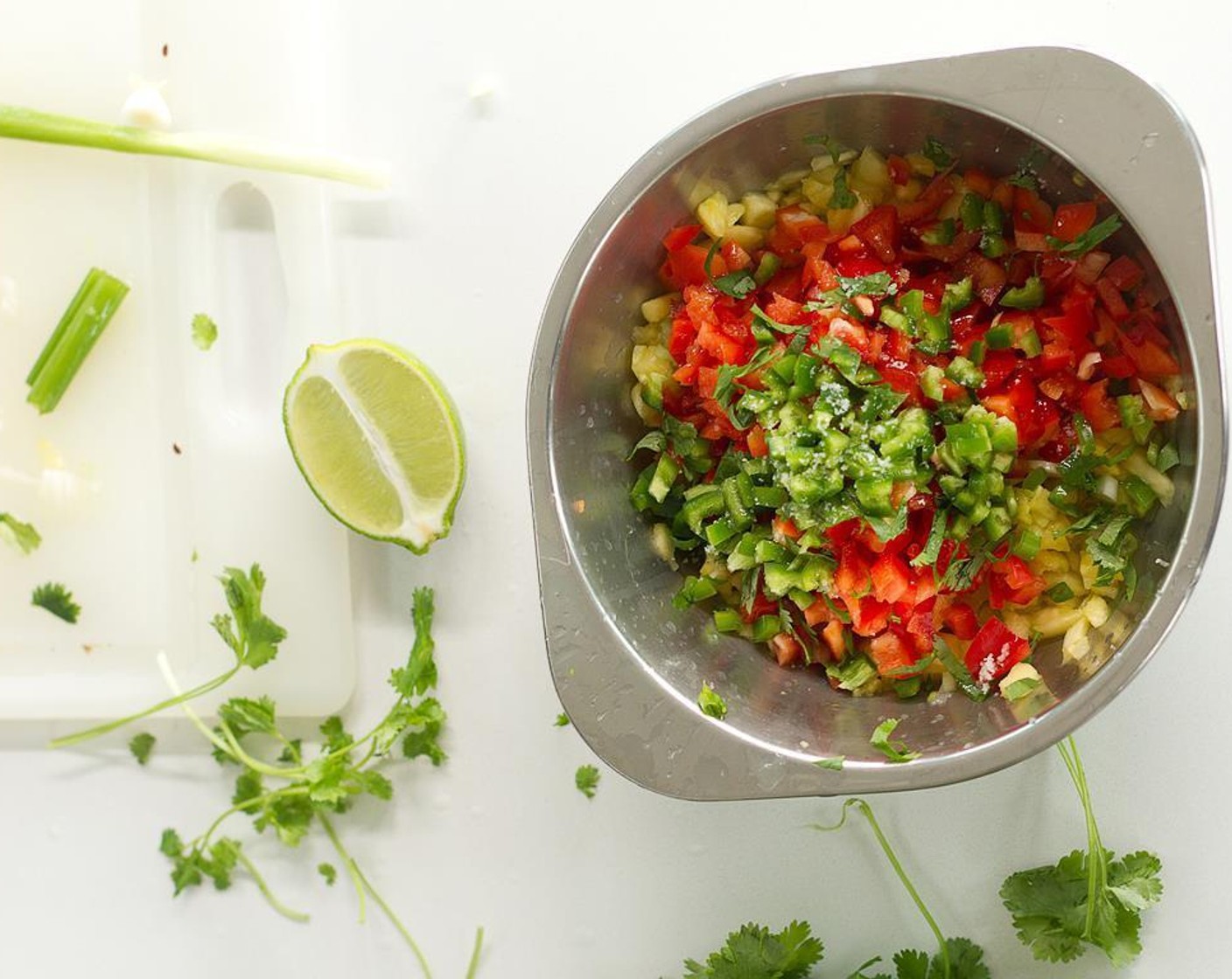 step 4 Combine Canned Diced Pineapple (3 1/3 cups), scallion, red bell pepper, jalapeño pepper, cilantro, the remaining garlic, the remaining Lemon Juice, Chili Powder (1 tsp), Salt (1/4 tsp), and Extra-Virgin Olive Oil (1/2 tsp). Cover and place in the refrigerator overnight.