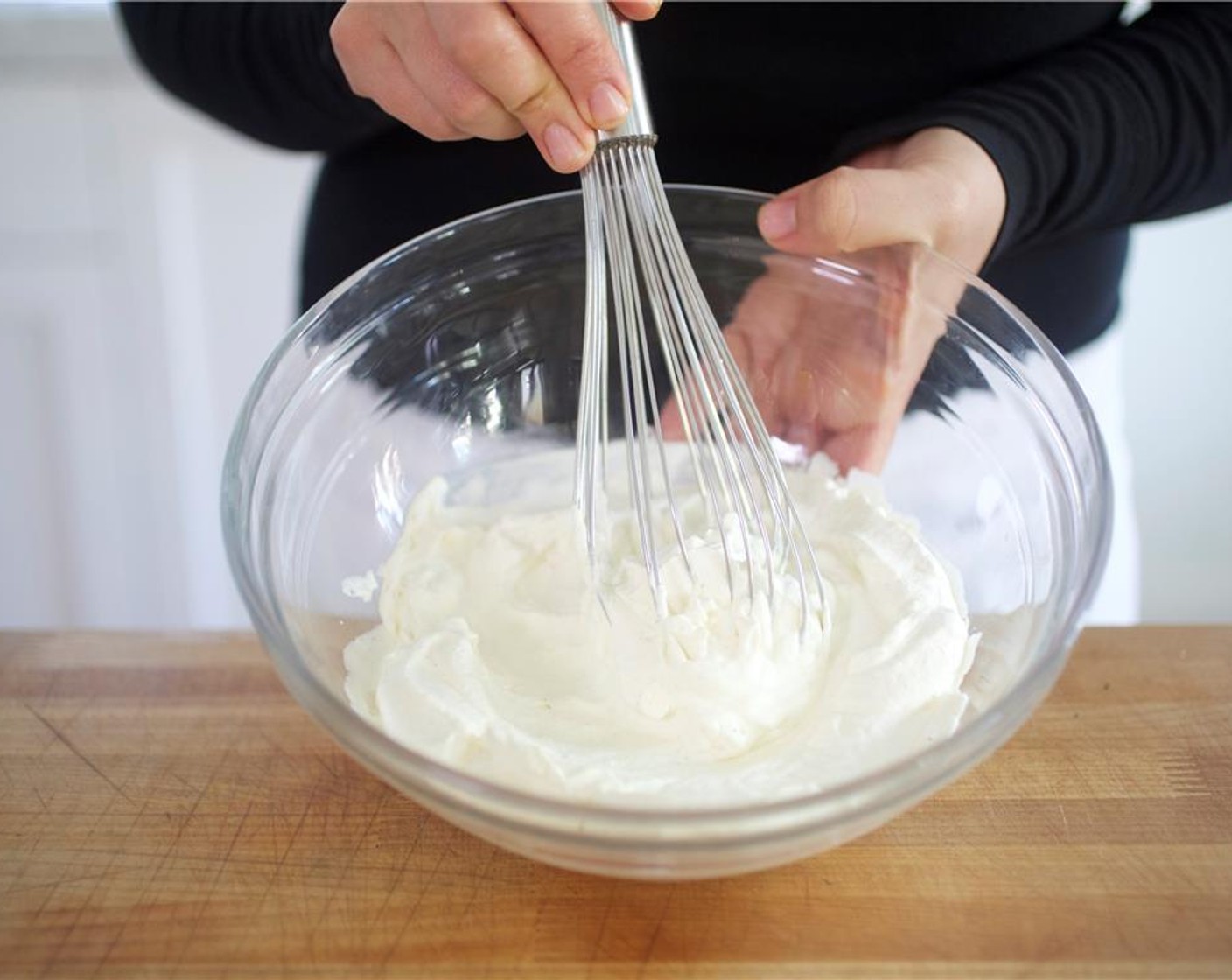 step 9 Place half of Kemps Heavy Whipping Cream (4 fl oz) into the chilled bowl. Whisk rapidly until the cream reaches stiff peaks, about 11 minutes.