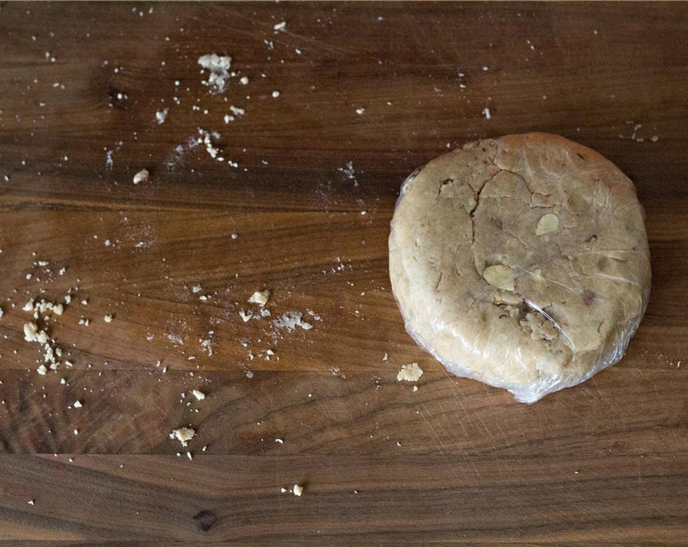 step 5 Form the dough into a round flat disc, and cover with plastic wrap. Place it in the refrigerator for at least an hour or up to overnight.