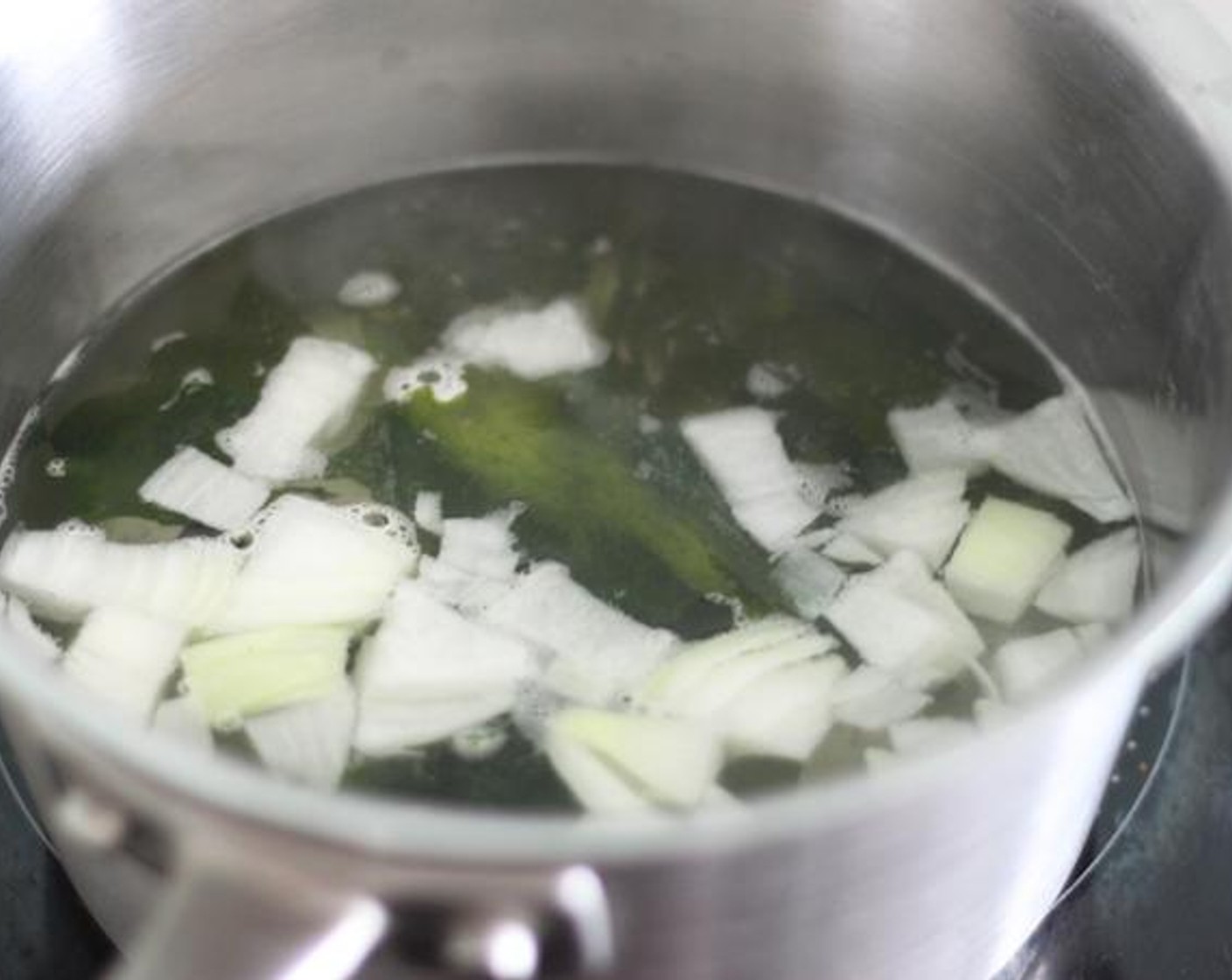 step 5 Prepare a large pot with water and bring the mixture to a boil and set the heat medium-low. I like just Dried Seaweed (1/2 cup) and Onion (1/2) this time, but you can add more veggies if you like.