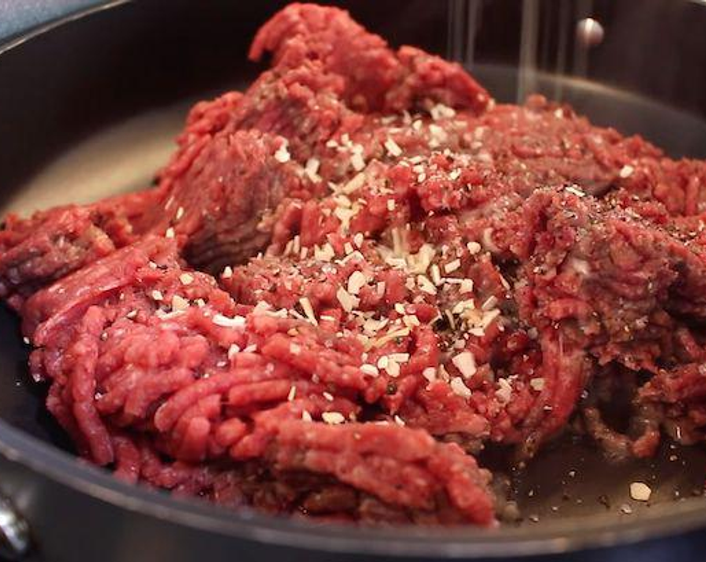 step 1 In a large non-stick pan over medium/high heat, brown the Ground Beef (2 lb), Onion Flakes (2 Tbsp), Worcestershire Sauce (1 Tbsp), Salt (to taste), and Ground Black Pepper (to taste). Drain excess grease and transfer to a large casserole dish.