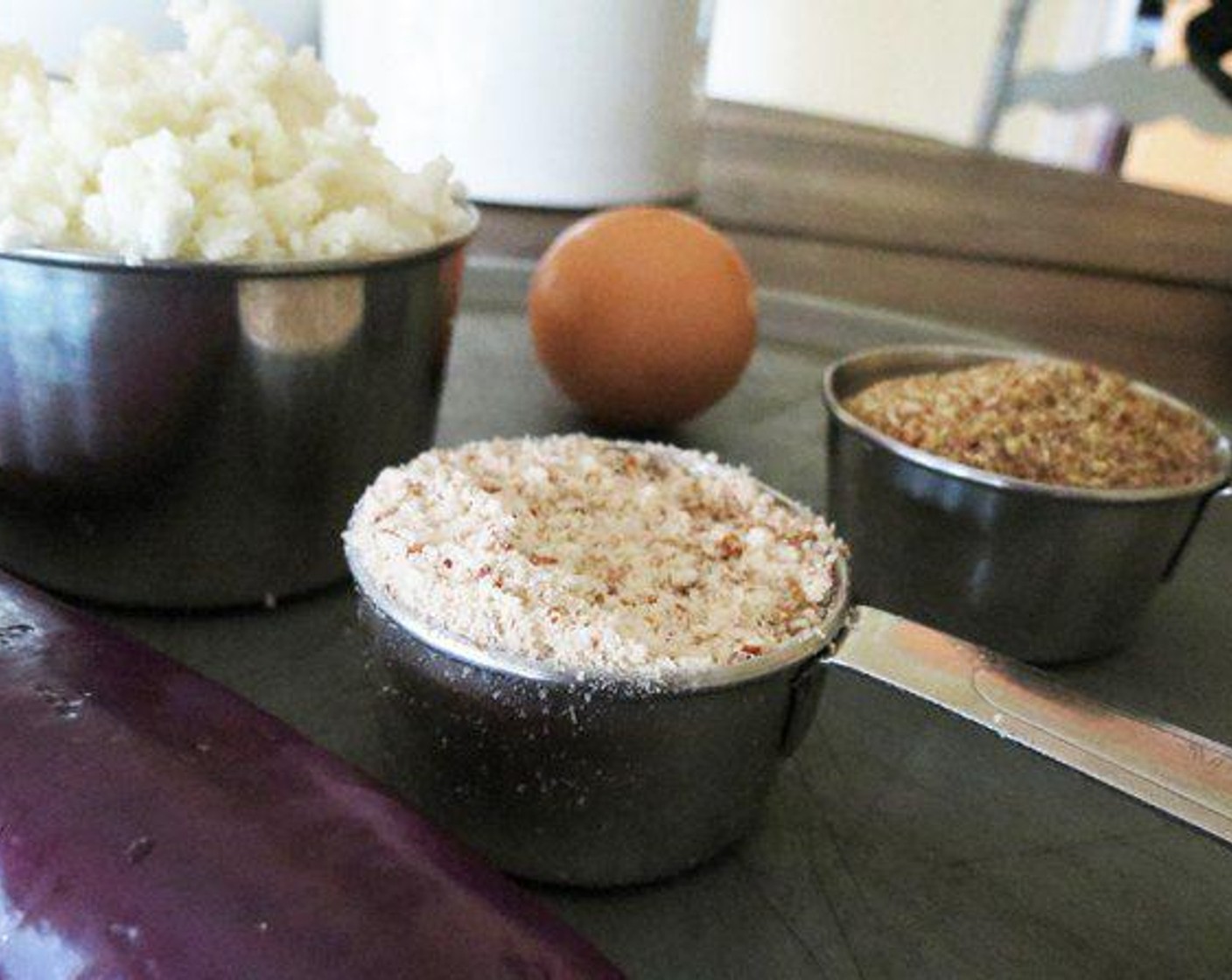 step 2 Peel skin from Eggplant (1) and cut into small cubes, add eggplant and Cauliflower (2 cups) to a food processor and rice.