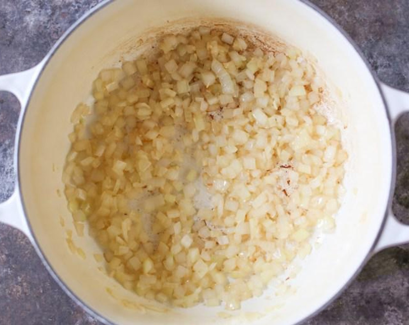 step 1 Heat the Extra-Virgin Coconut Oil (1 Tbsp) in a medium Dutch oven over medium heat. When the oil is hot and shimmering, add the Yellow Onion (1) and Garlic (2 cloves) and cook for about 5 minutes until the onions are translucent. (Be careful not to burn the garlic! If it starts to brown at all, reduce the heat, stat!)