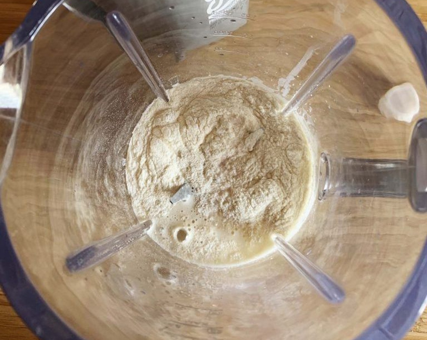 step 1 Place Vanilla Protein Powder (1 scoop), Almonds (1/3 cup), Water (1 cup), and Salt (1 pinch) in a blender.