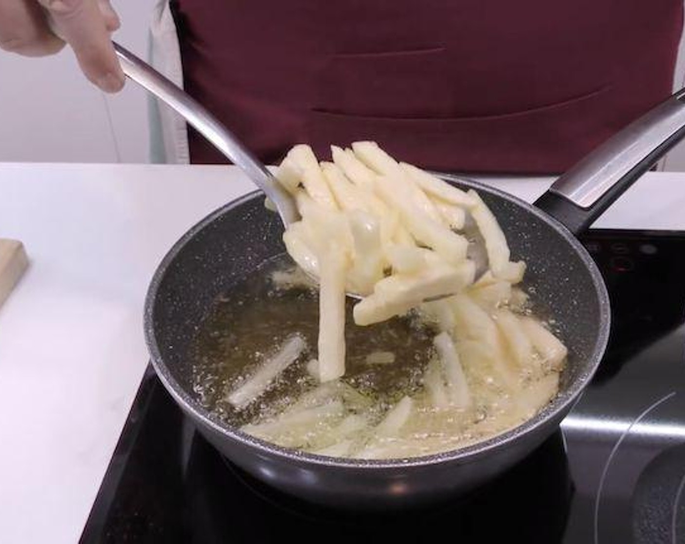 step 5 Once the fries are almost fully cooked remove from the pan and place in a bowl. Bring the oil up to high heat and put the fries back in the oil until golden brown.