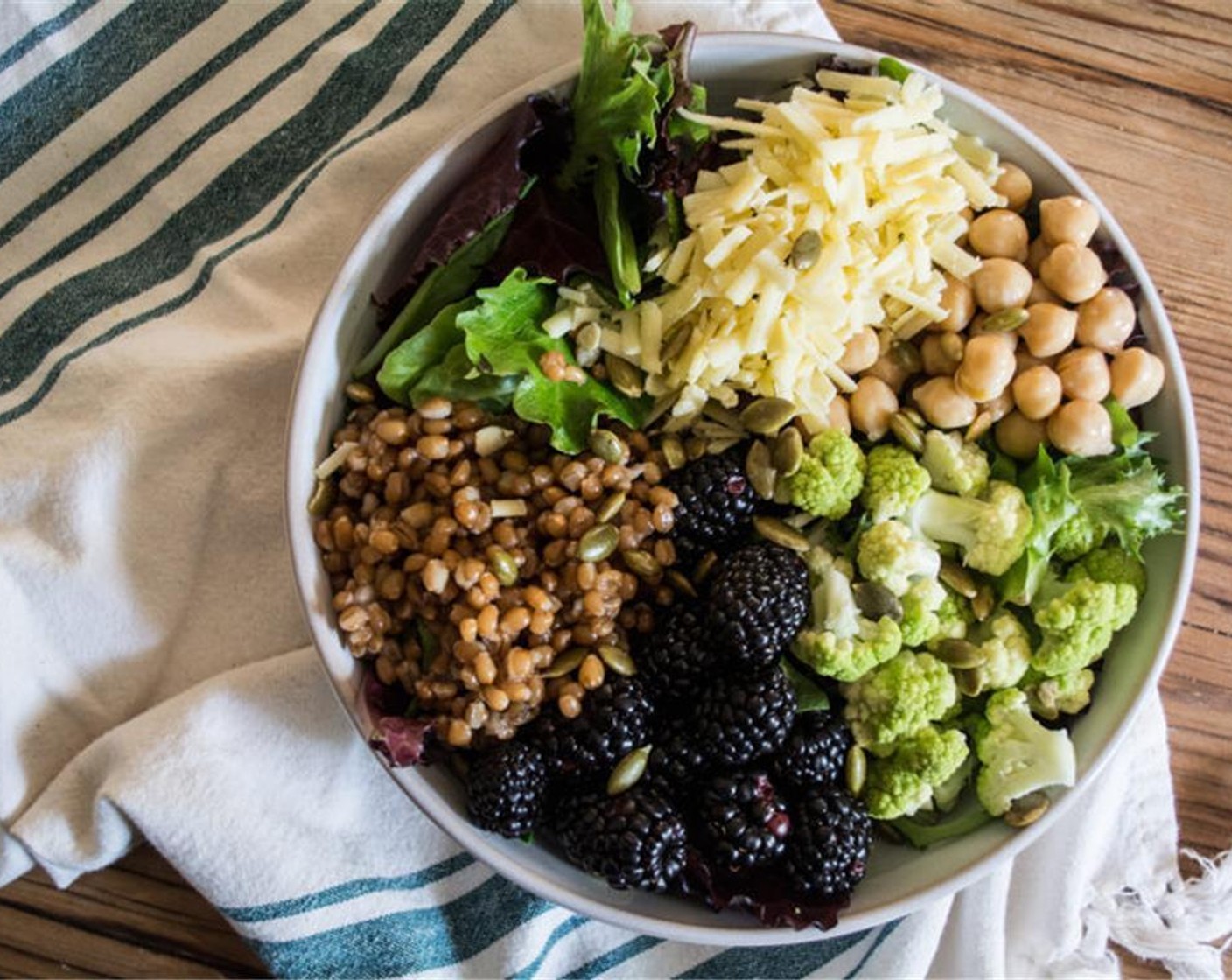 step 3 Once the wheat berries have cooked and cooled, add to salad, top with dressing of choice and serve.