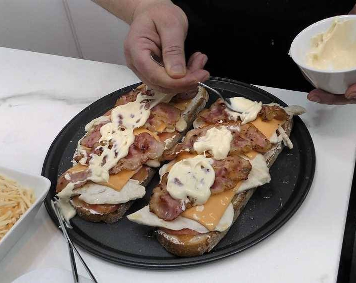 step 4 Add 2 slices of Cheddar Cheese (4 slices) per sandwich, cover with the fried bacon and add layer of Mayonnaise (to taste).