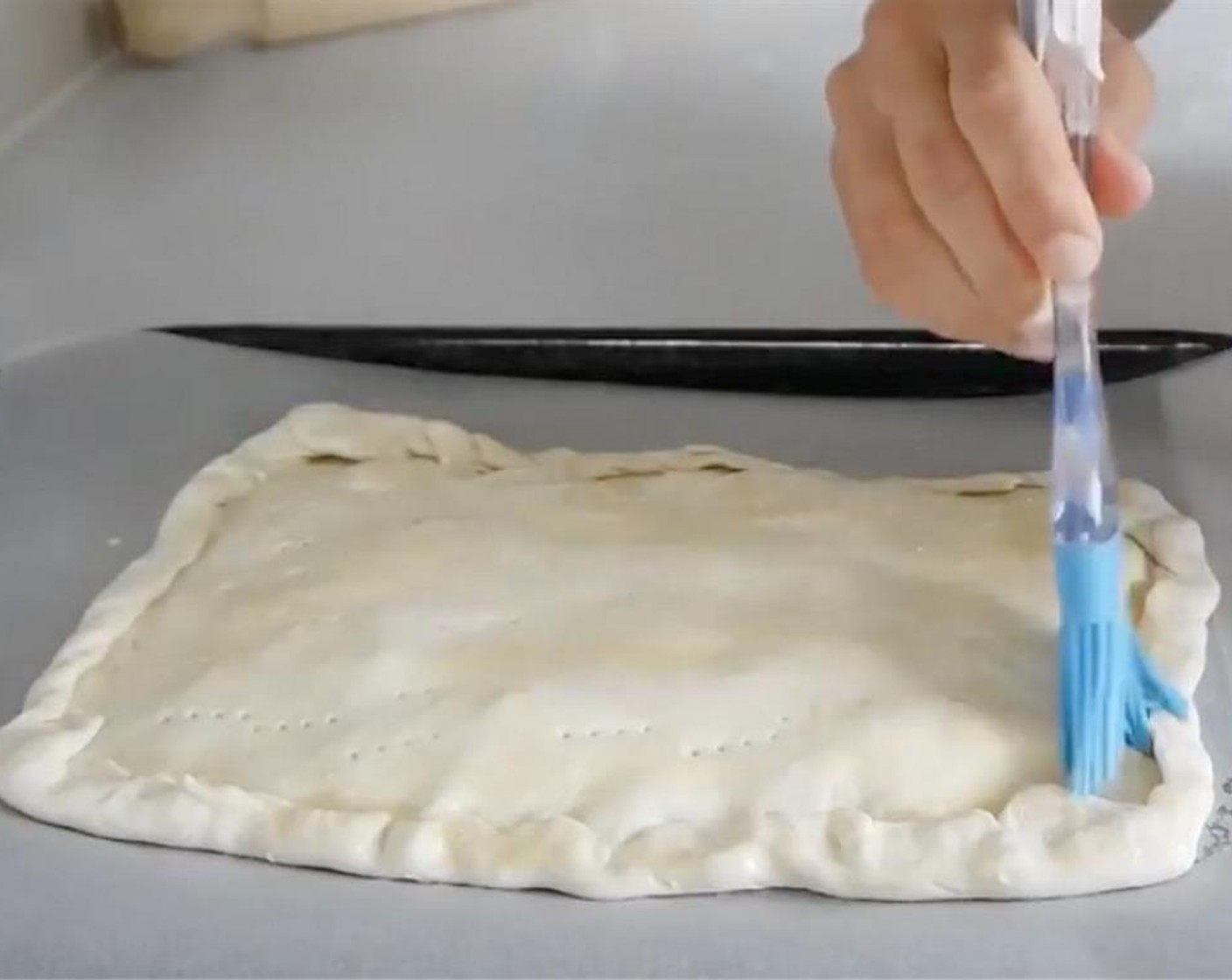 step 12 Beat a Free Range Egg (1) and brush the egg wash all over the surface of the pie.