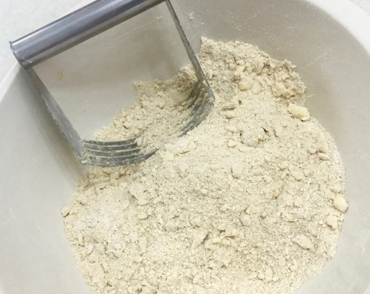 step 8 Using a pastry cutter, cut the cold butter into the flour mixture until the mixture resembles coarse crumbs.