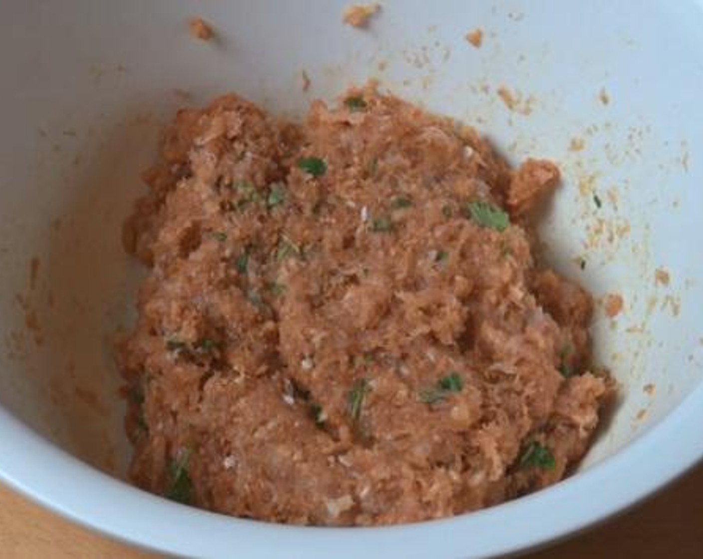 step 2 Using your hands, mix together the Chicken Breasts (2.2 lb), Fresh Cilantro (1/2 cup), Yellow Onion (1), Taco Seasoning (1/4 cup), Breadcrumbs (1 cup), Salt (to taste) and Ground Black Pepper (to taste).