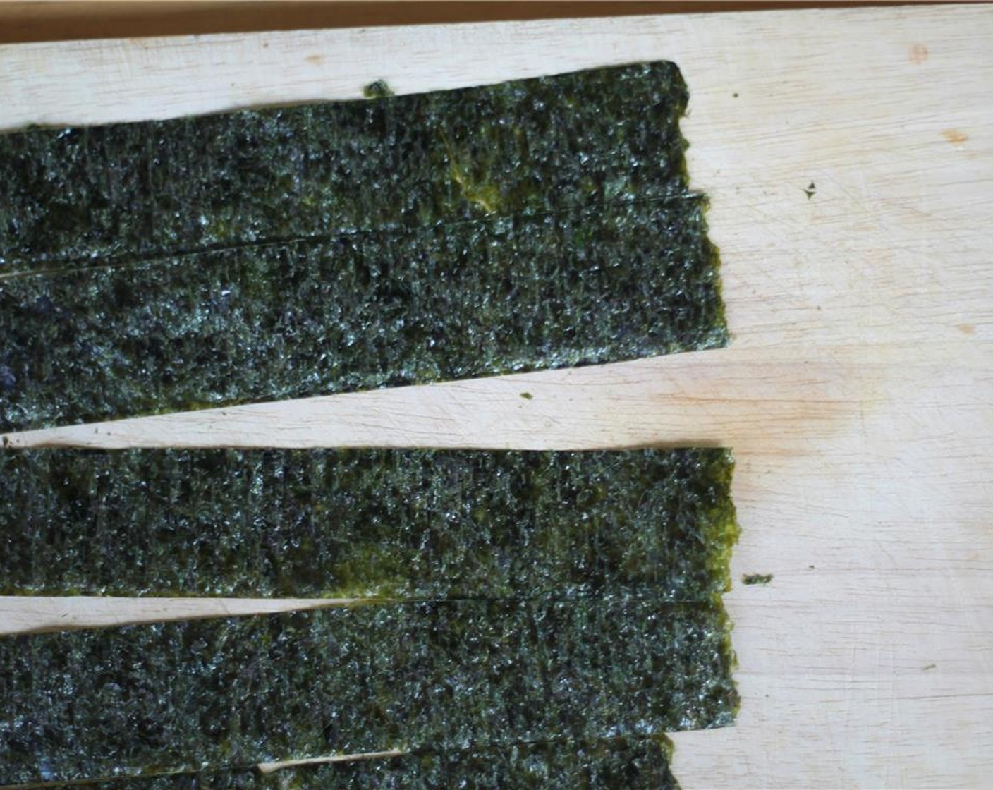 step 8 Meanwhile, cut the Nori Sheet (1 piece) into 1 1/2 inch strips for later.