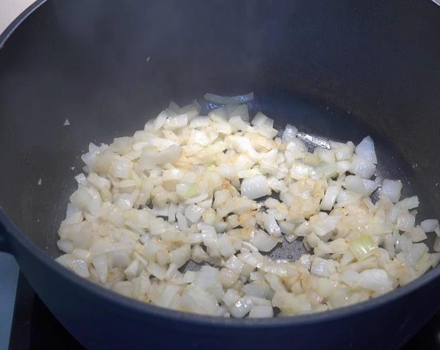 step 2 Into the same pot, add Onion (1), Garlic (1 tsp) and juice from Lemon (1). Cook, stirring occasionally, for 2-3 minutes, until the onions start to soften.