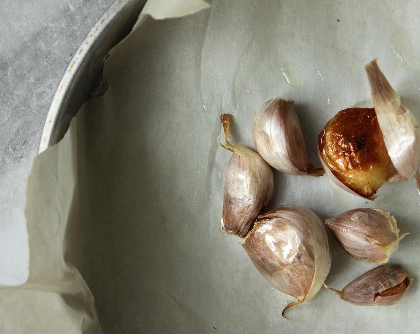 step 5 Once the garlic is cool enough to handle, peel the skins off, remove the hard nubs on the bottom end, and set aside.