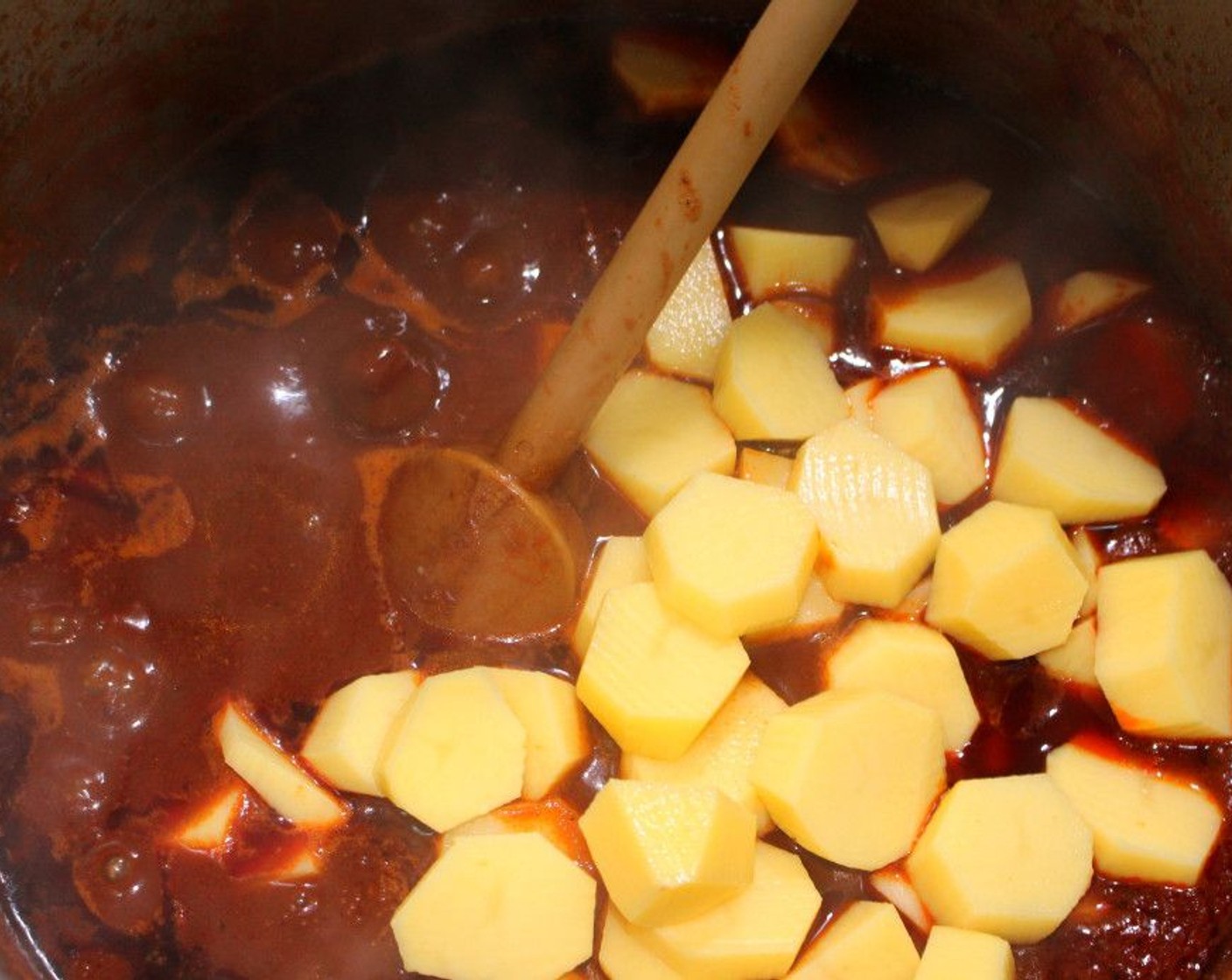 step 9 When the beef is soft, add the potatoes, simmer slowly until potatoes are soft but not falling apart, 20 minutes or so.