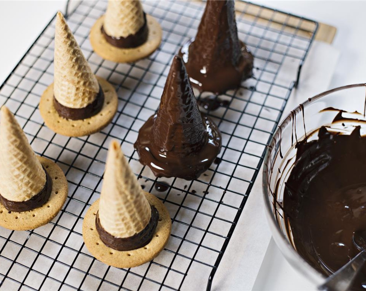 step 5 Coat each of the cones with melted dark chocolate.