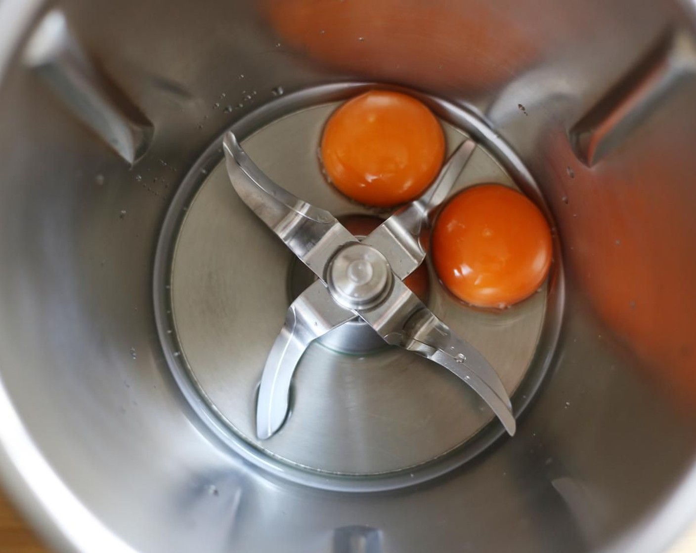 step 14 For the Gochujang Aioli, combine the yolks of the Eggs (2), White Wine Vinegar (2 Tbsp) in a high-speed blender and blend on high until combined.