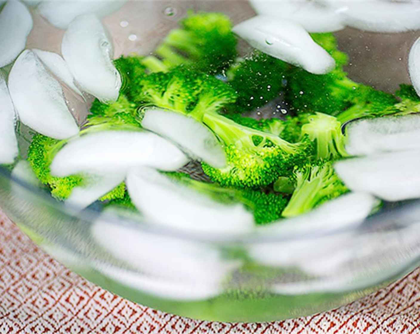 step 4 Immediately drain broccoli and plunge it into bowl of ice water to stop the cooking.