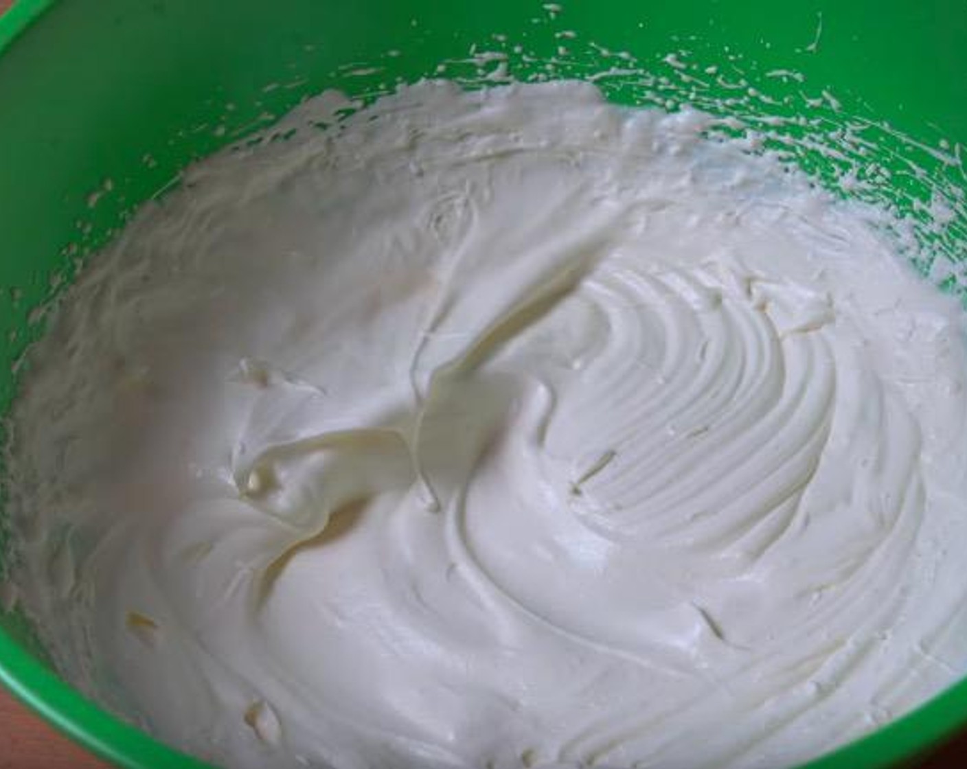 step 3 In a large mixing bowl, add Whipping Cream (1 cup). Beat until the mixture forms soft peaks.