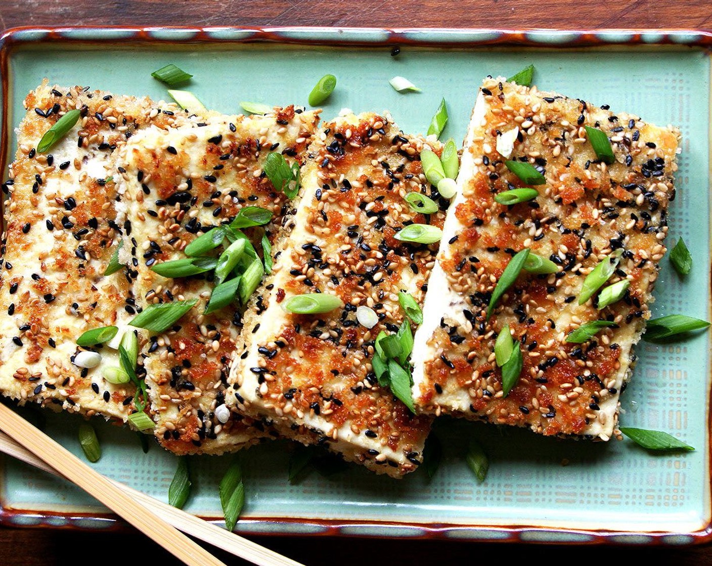 step 7 Cut each slice in half and then arrange them on a platter. Garnish with Scallions (to taste). Serve with nuoc cham and Sriracha (to taste) if you wish.