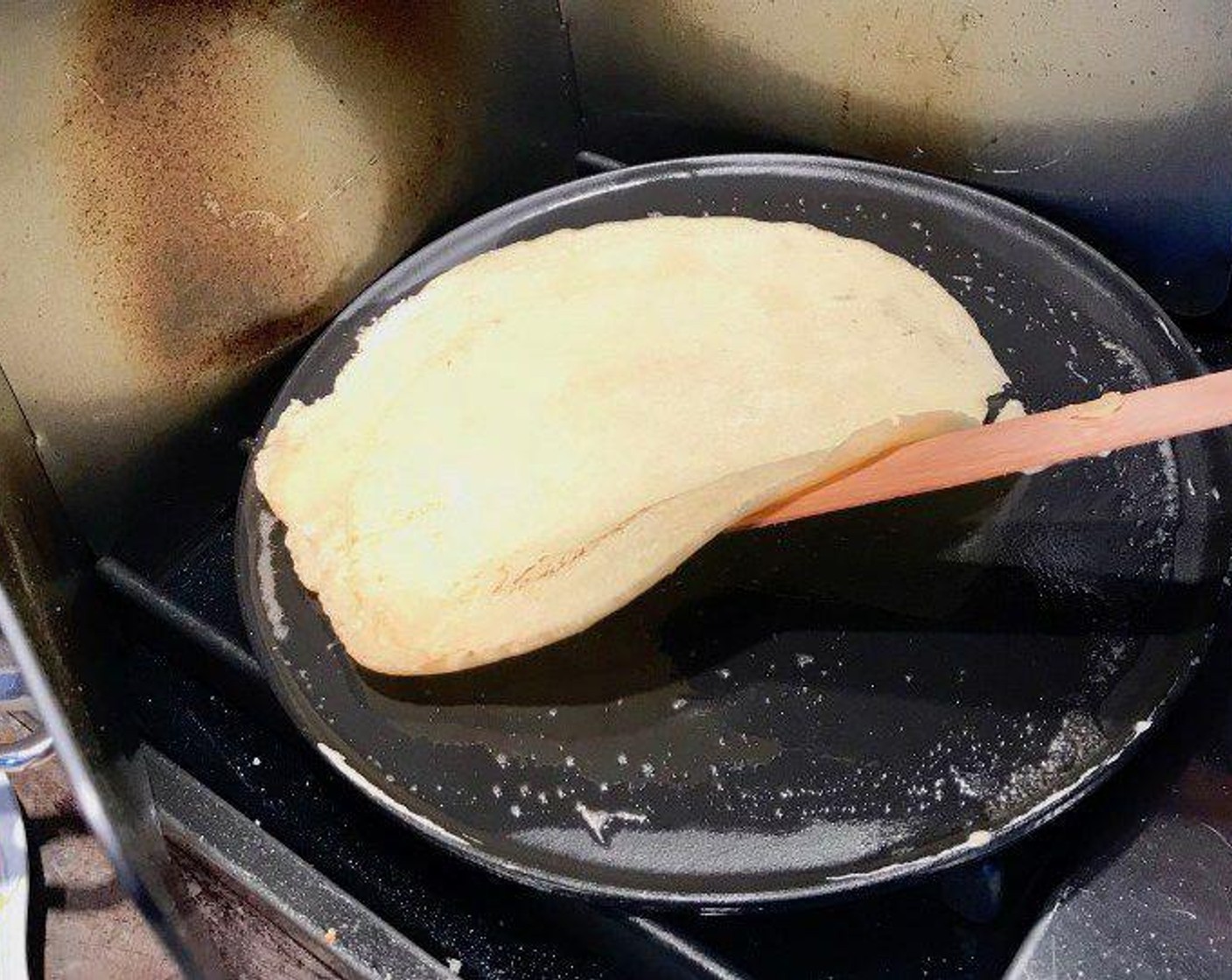 step 4 Cook the crêpe until it looks firm and is lightly browned around the edges, about 1 minute. Then flip the crêpe carefully with the spatula and cook on the other side for 30 more seconds.